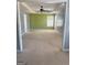 Spacious living room featuring a ceiling fan, and a large window for ample natural light at 117 Rendition Dr, Mcdonough, GA 30253