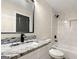 Modern bathroom with granite countertops and a tiled shower-tub combination at 1962 Compton Dr, Atlanta, GA 30315