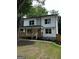 Inviting two-story home with a charming front porch and a well-manicured lawn at 1962 Compton Dr, Atlanta, GA 30315