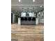 Open kitchen island with granite countertop, seating, and modern pendant lighting at 1962 Compton Dr, Atlanta, GA 30315
