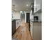 Renovated kitchen showcases granite countertops, stainless steel appliances, and hardwood floors at 1962 Compton Dr, Atlanta, GA 30315