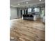 Open-concept living space featuring a modern kitchen island and hardwood floors throughout at 1962 Compton Dr, Atlanta, GA 30315