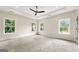 Bright main bedroom with plush carpeting, multiple windows, and recessed lighting at 1962 Compton Dr, Atlanta, GA 30315