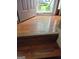 Staircase with hardwood steps leading to a front entrance filled with sunlight at 2443 Shoals Ter, Decatur, GA 30034