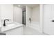 Bright bathroom showcasing a granite vanity, soaking tub, separate shower, and modern black fixtures at 3353 Arabian Farm Ln, Dacula, GA 30019
