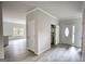 Bright entryway featuring an oval-window door, light-colored walls, and wood-look flooring, leading into the home at 695 Park Place Way, Social Circle, GA 30025