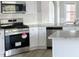 Open kitchen with stainless steel appliances and granite countertops at 695 Park Place Way, Social Circle, GA 30025