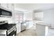 Bright eat-in kitchen with stainless steel appliances, island, and lots of cabinetry at 695 Park Place Way, Social Circle, GA 30025