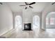 Spacious living room features a fireplace, high ceilings, archways, wood floors and lots of light at 695 Park Place Way, Social Circle, GA 30025
