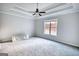 Spacious bedroom with tray ceiling, carpet floor, and large window for natural light at 695 Park Place Way, Social Circle, GA 30025
