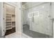 Modern bathroom with a glass enclosed shower, tiled walls, and a mosaic shower base at 1397 Thomas Rd, Decatur, GA 30030