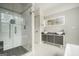 Bathroom featuring a glass shower, double sinks, and a modern vanity with great natural light at 1397 Thomas Rd, Decatur, GA 30030
