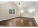 Spacious bedroom featuring vaulted ceilings, a large window and hardwood floors at 1397 Thomas Rd, Decatur, GA 30030
