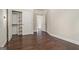 Bedroom with hardwood floors, organized closet, and neutral walls with natural light at 1397 Thomas Rd, Decatur, GA 30030