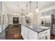 Modern kitchen island with gray countertops, stainless steel appliances, and an open floor plan at 1397 Thomas Rd, Decatur, GA 30030