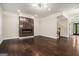 Bright living room featuring a linear fireplace, hardwood floors, and an open floor plan at 1397 Thomas Rd, Decatur, GA 30030