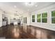 Open-concept living space with hardwood floors, abundant natural light, and a stylish kitchen at 1397 Thomas Rd, Decatur, GA 30030