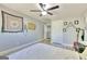 This bedroom offers ample space, a ceiling fan, and neutral walls for a relaxing and personalized retreat at 5845 Princeton Run Trl, Tucker, GA 30084