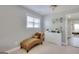 This bedroom provides a quiet reading space with a chaise lounge and a charming view at 5845 Princeton Run Trl, Tucker, GA 30084