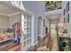 Spacious hallway featuring dark laminate flooring, arched doorways, and decorative accents at 5845 Princeton Run Trl, Tucker, GA 30084