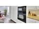 This modern kitchen boasts stainless steel appliances, sleek countertops, and ample storage space at 5845 Princeton Run Trl, Tucker, GA 30084