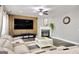 Cozy living room with a fireplace, a large TV, and a comfortable sofa at 5845 Princeton Run Trl, Tucker, GA 30084