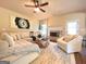 Inviting living room with a cozy fireplace and comfortable seating arrangement at 104 Beautiful Way Lot 48 # 48, Locust Grove, GA 30248