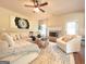 Inviting living room with a cozy fireplace and comfortable seating arrangement at 104 Beautiful Way Lot 48 # 48, Locust Grove, GA 30248
