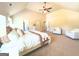 Large main bedroom featuring a vaulted ceiling, ceiling fan, ensuite access, and sitting area at 104 Beautiful Way Lot 48 # 48, Locust Grove, GA 30248