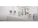 Modern bathroom featuring double sinks, large mirror, and a sleek shower at 2278 Santa Fe St, Morrow, GA 30260