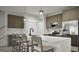 Modern kitchen with stainless steel appliances, wood cabinets, and a large island at 2278 Santa Fe St, Morrow, GA 30260