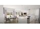 Open-concept living space with kitchen, dining area, and living room at 2278 Santa Fe St, Morrow, GA 30260