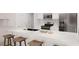 Modern kitchen featuring stainless steel appliances, a large island, and sleek white cabinets at 2280 Santa Fe St, Morrow, GA 30260