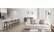 Bright, open-concept living room and dining area with modern furnishings and ample natural light at 2280 Santa Fe St, Morrow, GA 30260