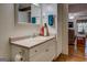 Bright bathroom featuring vanity with sink and mirror at 2000 Campbell Rd, Covington, GA 30014