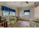 Spacious bedroom featuring large windows, a cozy corner, and ample space for relaxation at 2000 Campbell Rd, Covington, GA 30014