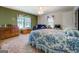 Comfortable bedroom with a blue sofa, TV and windows offering natural light and cozy feel at 2000 Campbell Rd, Covington, GA 30014