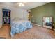 Relaxing bedroom with closet, mirror, and a blue-patterned comforter creating a serene space at 2000 Campbell Rd, Covington, GA 30014