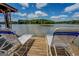 Wooden boat dock with a clear view of the lake, complete with lounge chairs for relaxing by the water at 2000 Campbell Rd, Covington, GA 30014