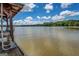 Close-up of a boat dock showcasing a motorboat, situated in a tranquil lake surrounded by verdant foliage at 2000 Campbell Rd, Covington, GA 30014
