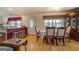 Open floor plan dining area with seating and wood flooring at 2000 Campbell Rd, Covington, GA 30014