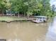 Scenic view of a private dock with boats and seating, perfect for lakeside relaxation and enjoyment at 2000 Campbell Rd, Covington, GA 30014