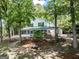 Charming two-story home featuring a screened porch and lush greenery, surrounded by nature at 2000 Campbell Rd, Covington, GA 30014