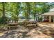 Patio area with picnic tables, grill, and lake views at 2000 Campbell Rd, Covington, GA 30014