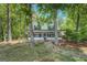 Inviting two-story home with screened-in porch and lush landscaping at 2000 Campbell Rd, Covington, GA 30014