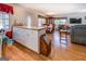 Spacious kitchen and dining area with wood flooring and plenty of natural light at 2000 Campbell Rd, Covington, GA 30014