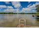 Lake view with ladders, clear blue skies, and picturesque views of the homes across the lake at 2000 Campbell Rd, Covington, GA 30014
