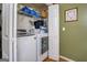 Modern laundry room with front load washer and dryer set at 2000 Campbell Rd, Covington, GA 30014