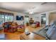 Spacious living room with wood floors, cozy seating, and a fireplace at 2000 Campbell Rd, Covington, GA 30014