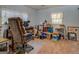 A cluttered office with desk, chair, shelving, and supplies, offering functional workspace at 2000 Campbell Rd, Covington, GA 30014